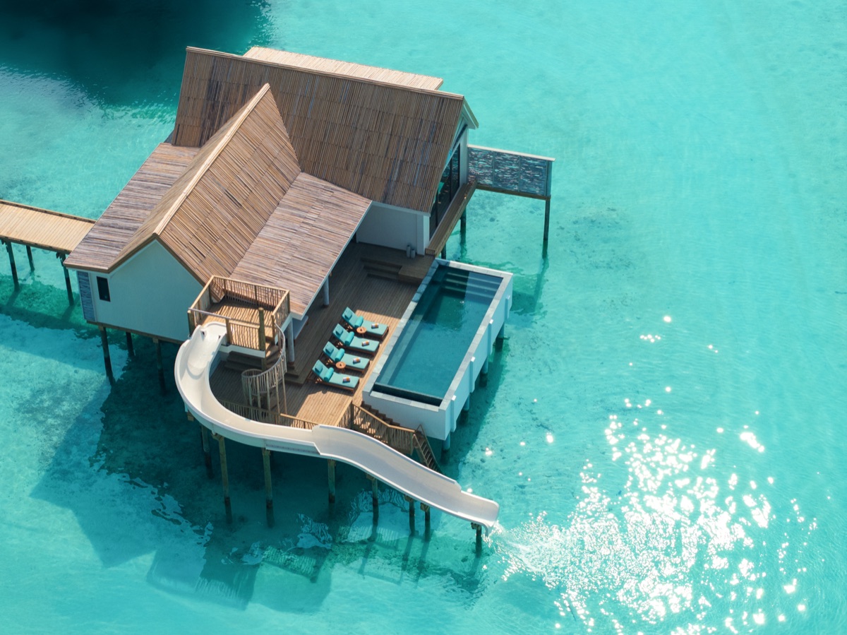 Overwater villa with a private pool and slide in the Maldives